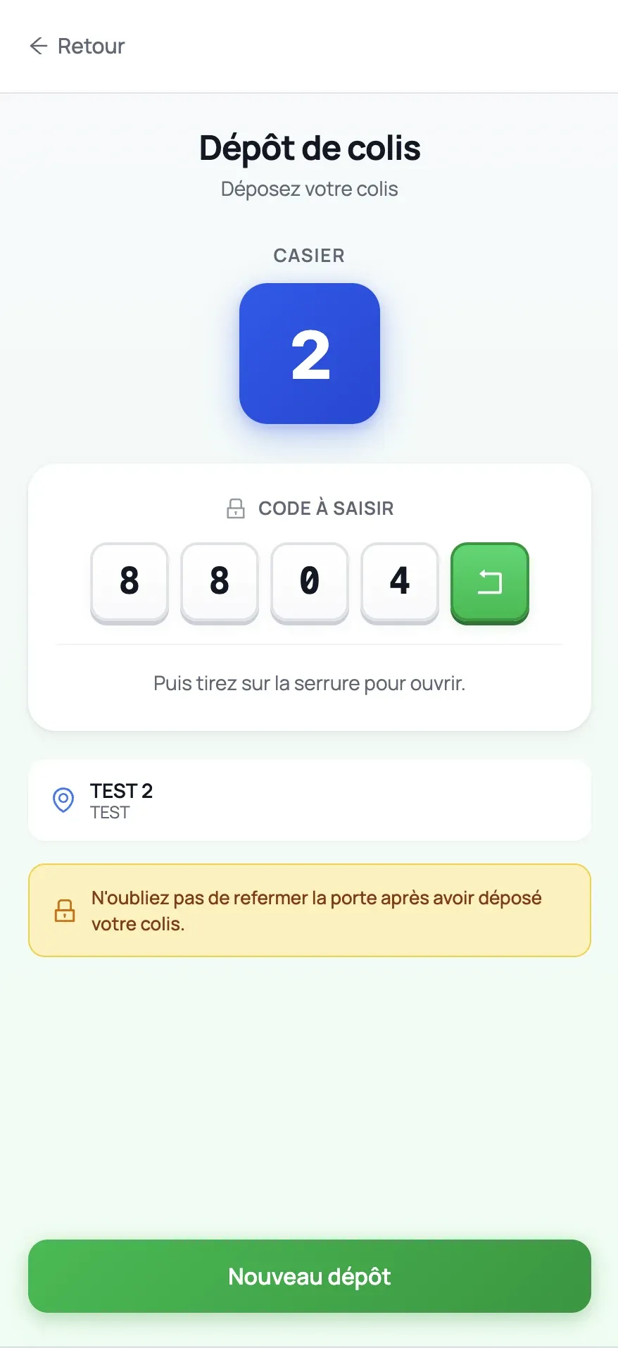 Écran mobile de dépôt de colis Drive-Cube indiquant le casier et les instructions d’ouverture, dans l’environnement de test